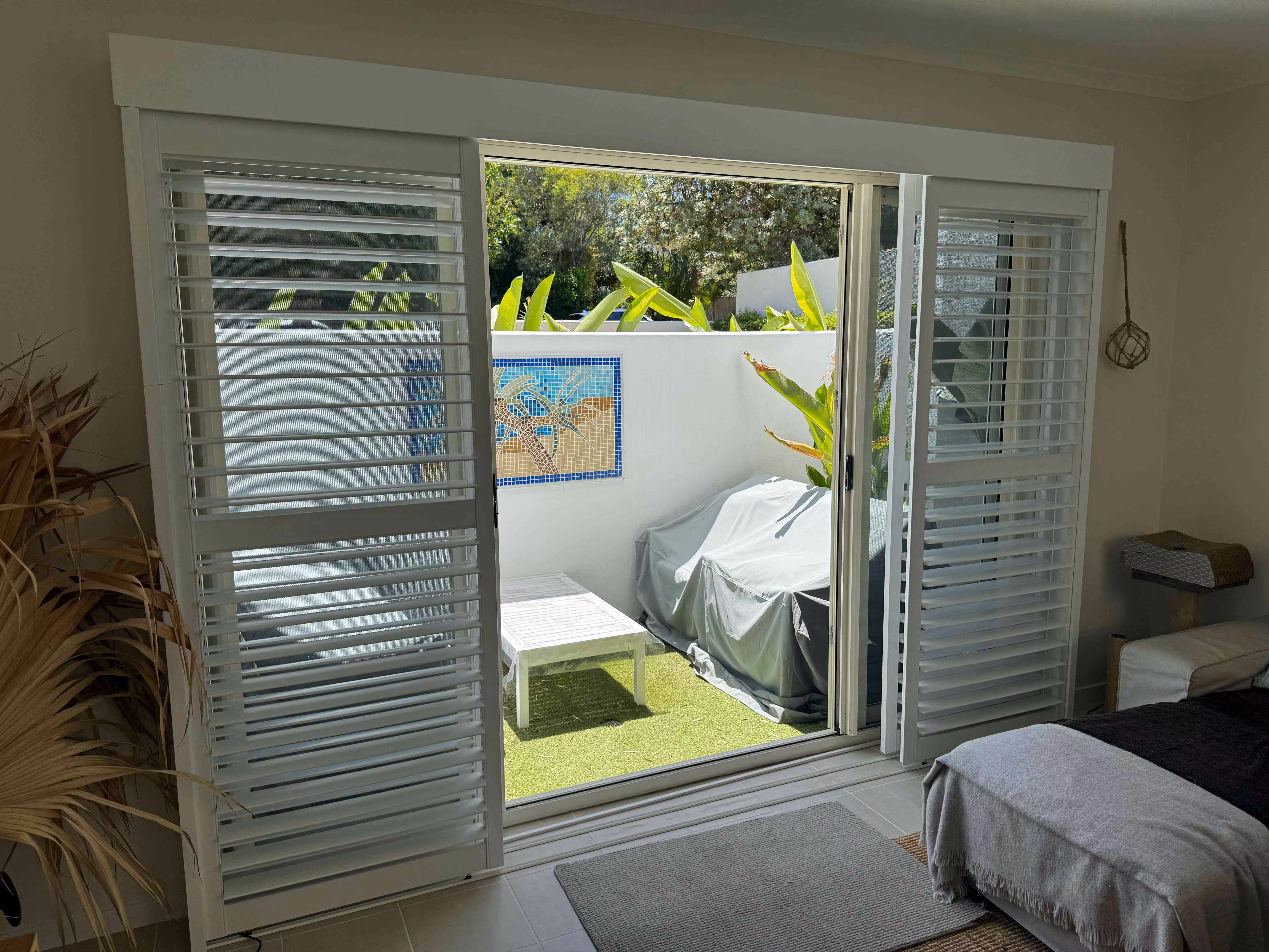 scaled_Hamptons PVC Plantation Shutters - 89mm Blades - Sliding In Open Position - Face Fit Frame - Open Position - Blades and Midrails Aligned